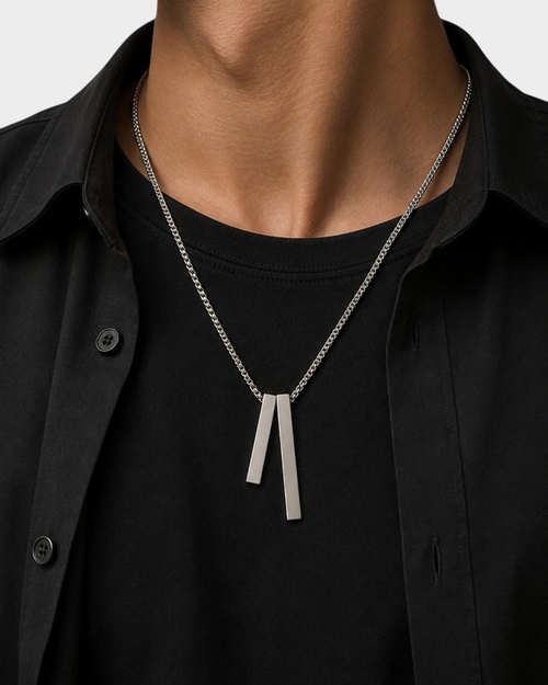 SIEVRA Axis pendant necklace featuring two polished titanium steel square pillar charms on a snake bone chain.