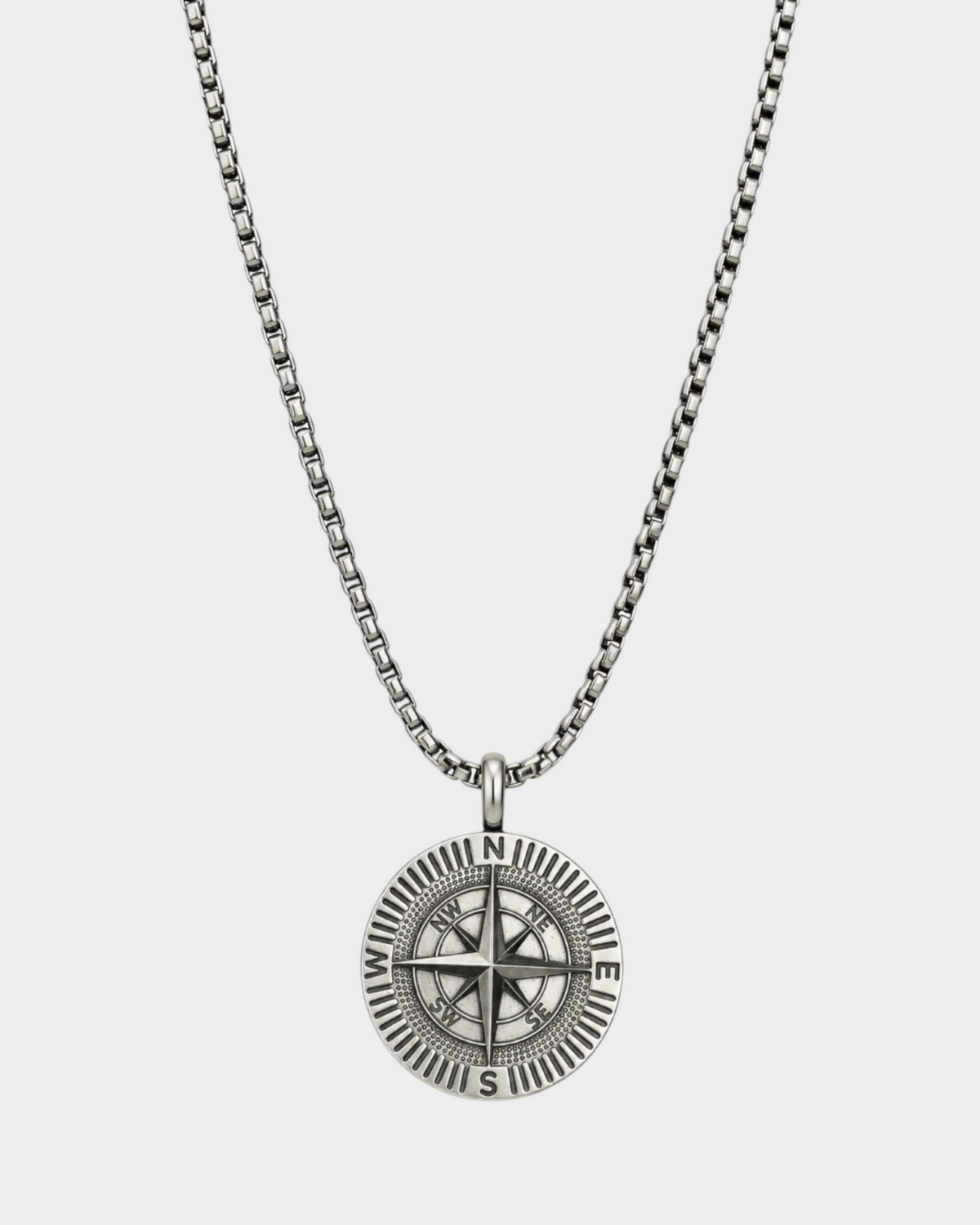 SIEVRA Bearing pendant necklace featuring a stainless steel compass medallion on an adjustable Cuban curb chain.