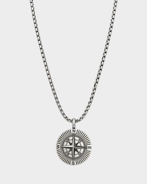 SIEVRA Bearing pendant necklace featuring a stainless steel compass medallion on an adjustable Cuban curb chain