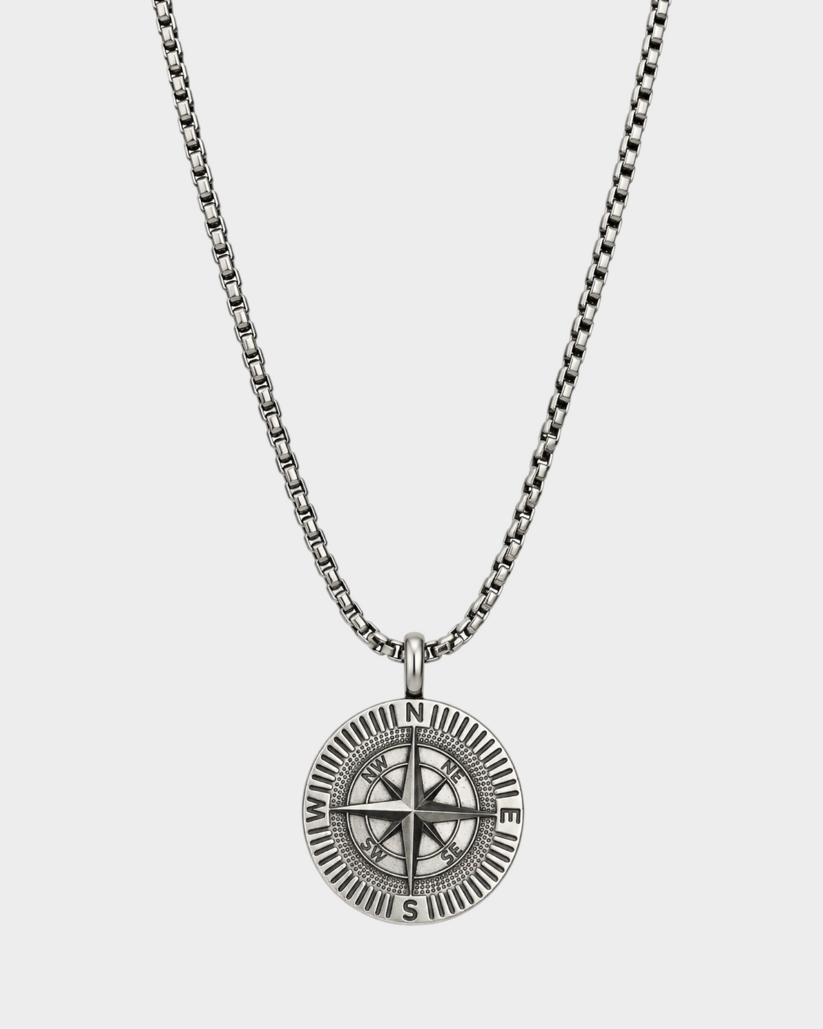 SIEVRA Bearing pendant necklace featuring a stainless steel compass medallion on an adjustable Cuban curb chain.