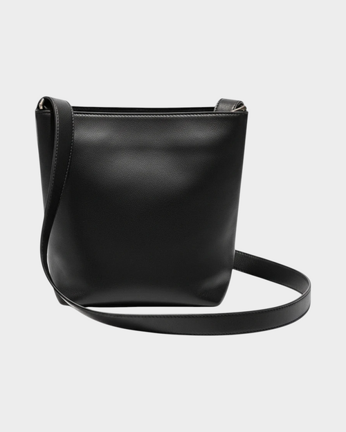 SIEVRA Basin black full-grain cowhide leather bucket crossbody bag with a structured silhouette and shoulder strap.