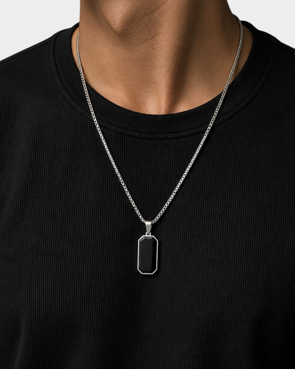 SIEVRA Slate pendant necklace featuring a geometric black inlay on a stainless steel bead chain worn on a model