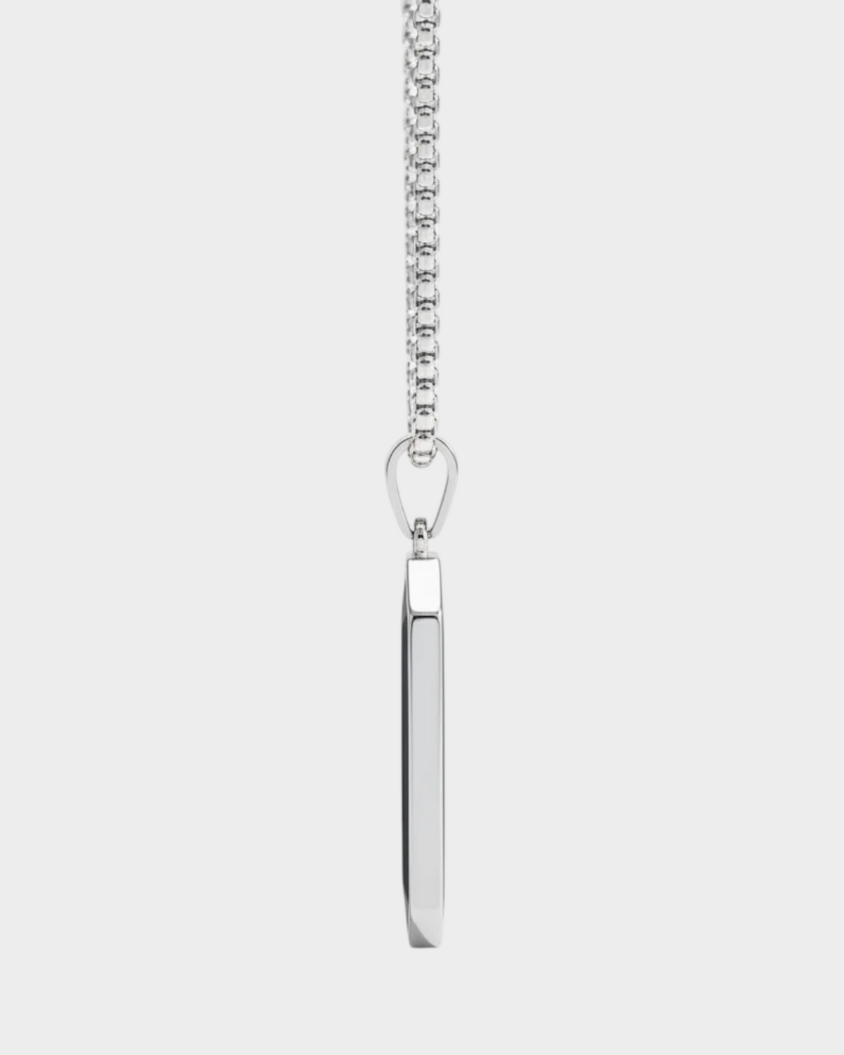 SIEVRA Slate pendant necklace featuring a geometric black inlay on a stainless steel bead chain, side profile view.