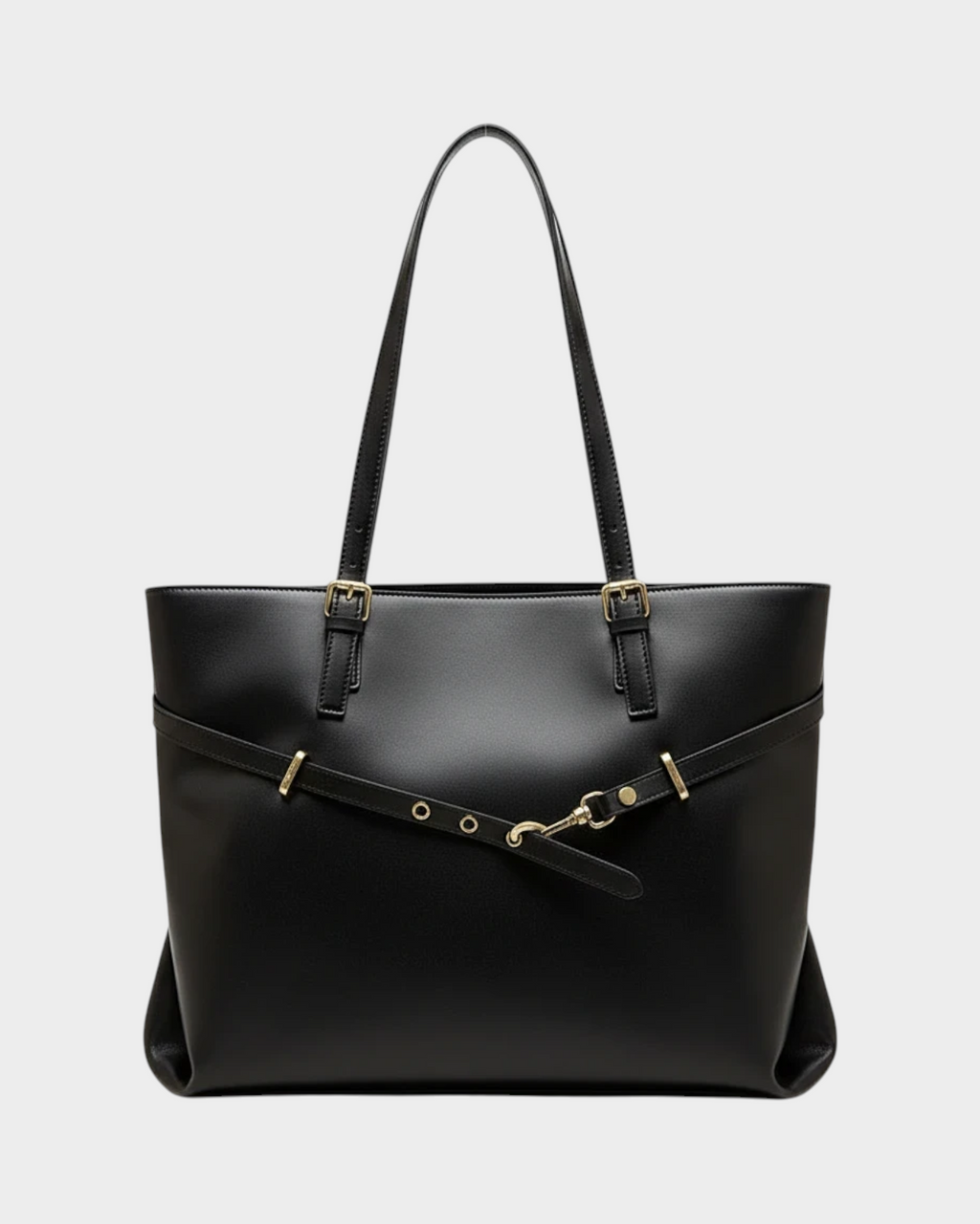 SIEVRA Span black vegan leather tote bag with gold hardware and adjustable strap detail for daily commuting.