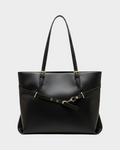 SIEVRA Span black vegan leather tote bag with gold hardware and adjustable strap detail for daily commuting.