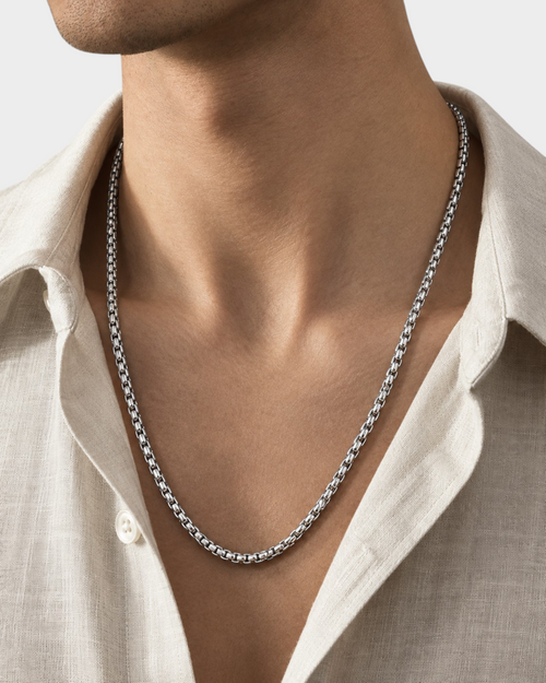 SIEVRA polished silver stainless steel bead chain necklace worn by a man in a beige linen shirt